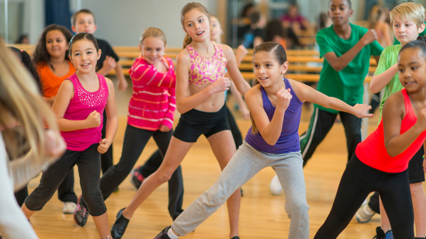 Diverse group of children enjoying a dance activity