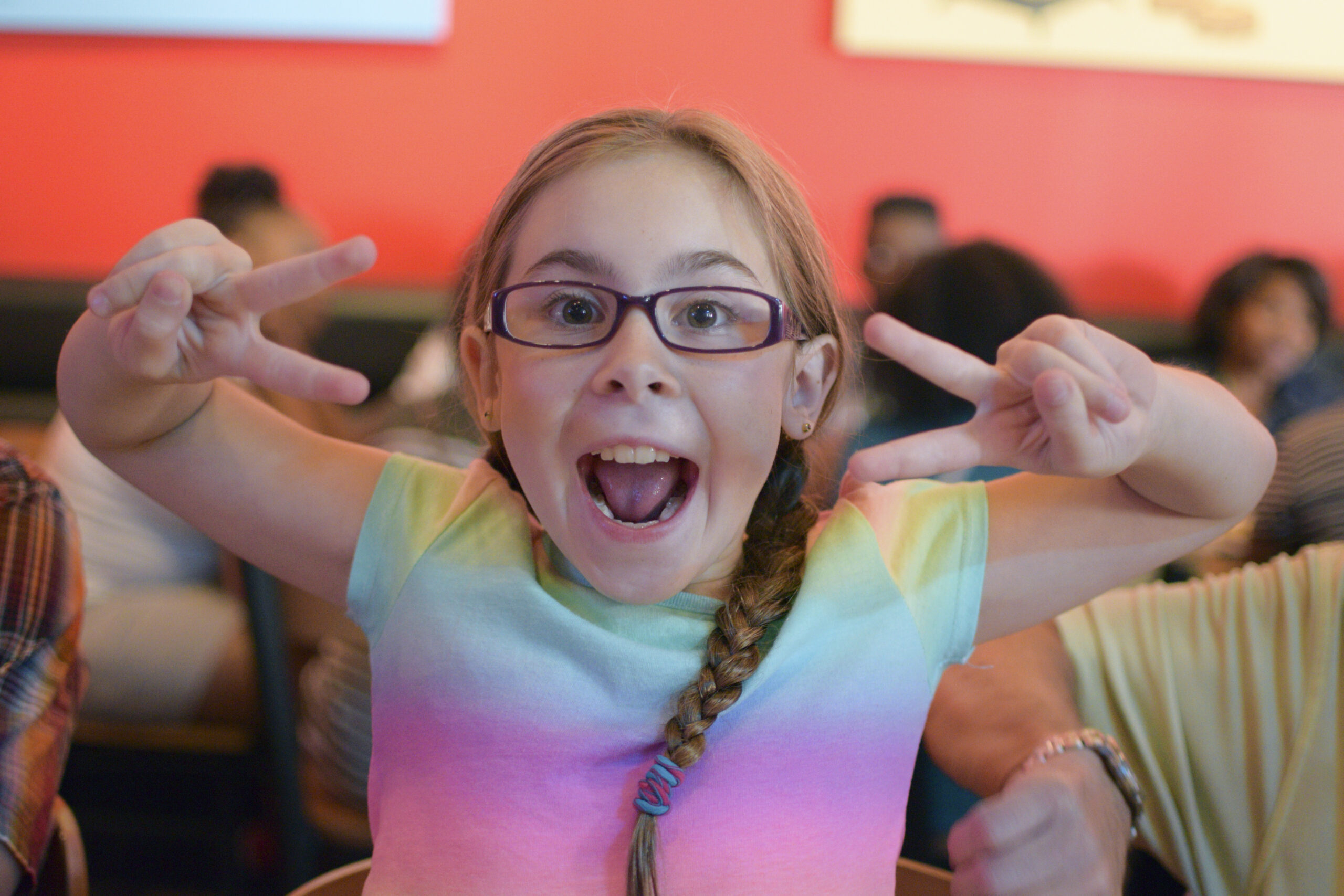 Happy girl smiling for the camera at Horizon Kids Club