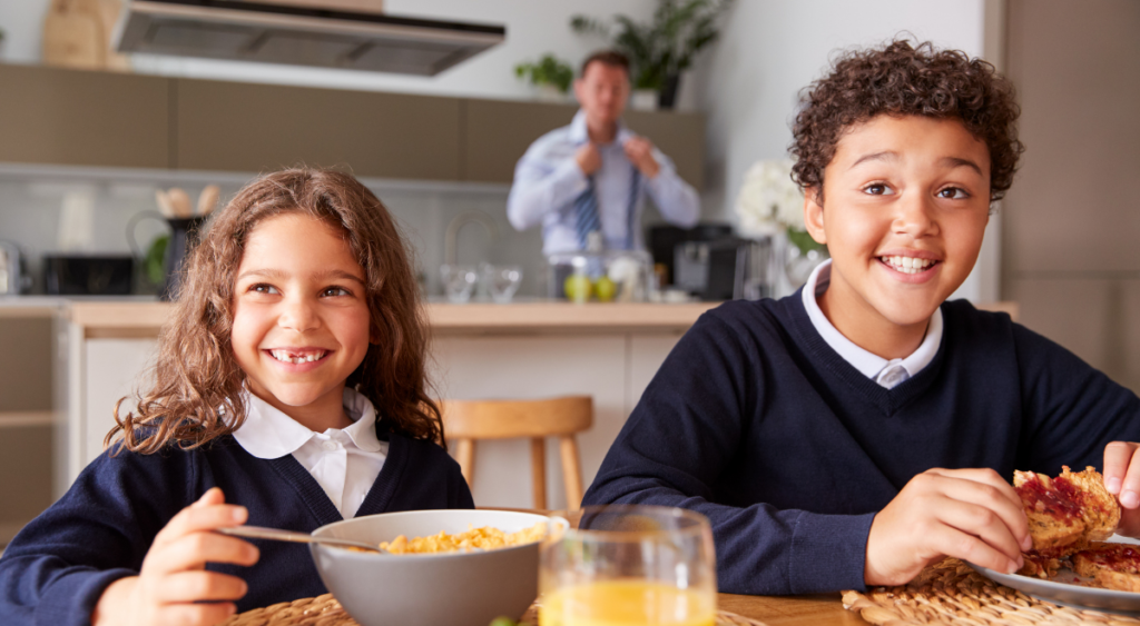 Preparing for back to school while kids having breakfast